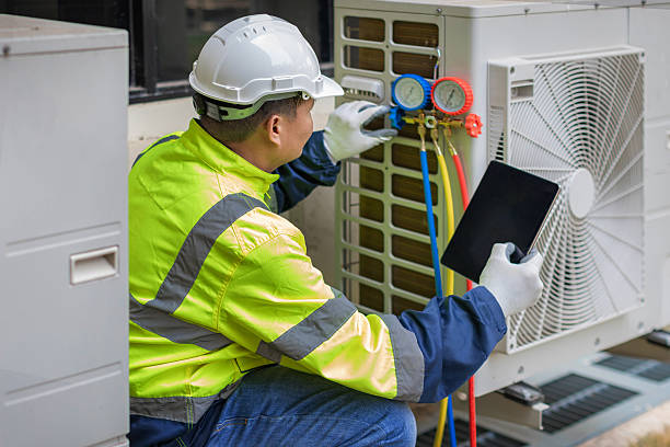 Professional Air Conditioning Repair technician working in Wilson, OK